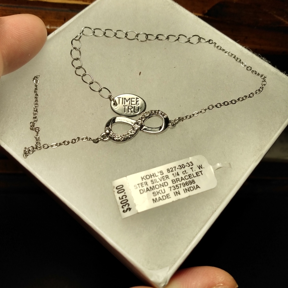 Diamond and silver bracelet omega sumbol